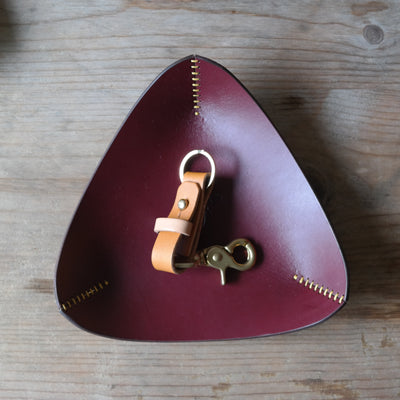 Triangle leather coin tray in deep plum British leather